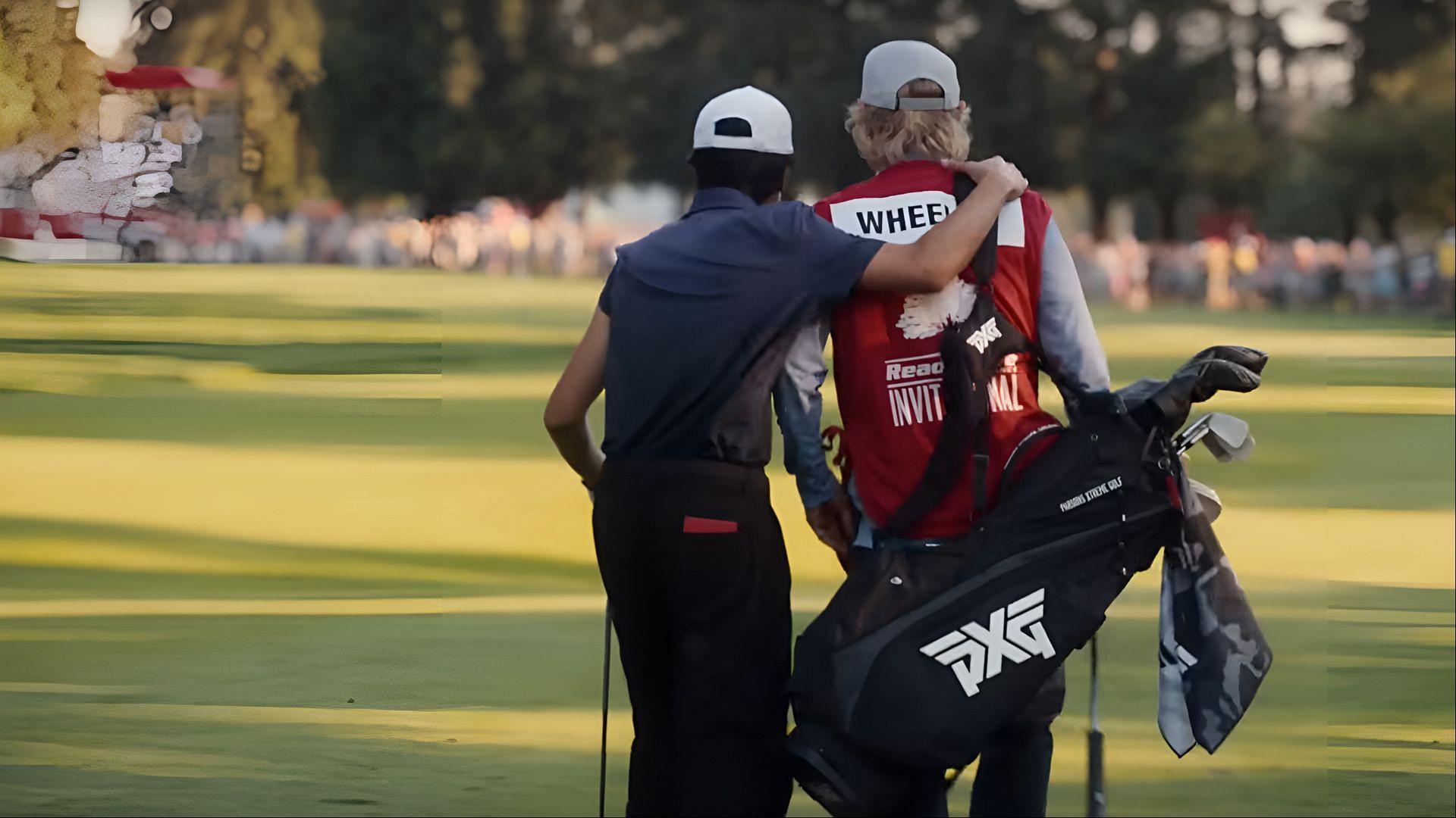 Peter Dager as Santi Wheeler and Owen Wilson as Pryce Cahill – Santi and Pryce walk off the green after a tournament round, showing their growing partnership. (Image via YouTube/Apple TV+)